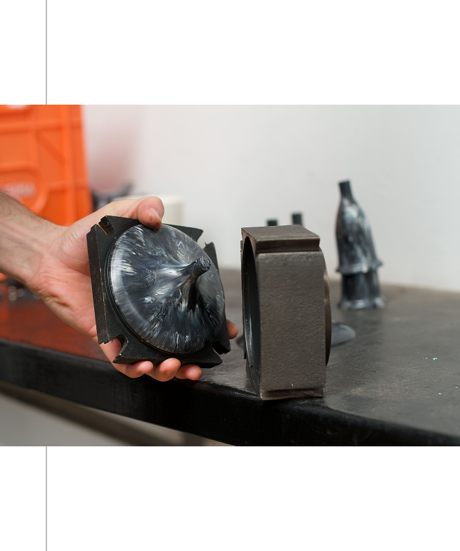 Industrial mold pieces on workbench