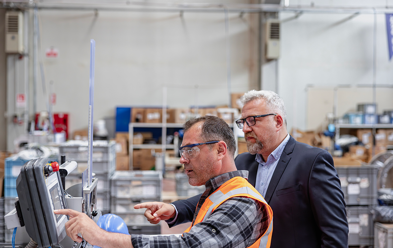 Two men in industrial setting