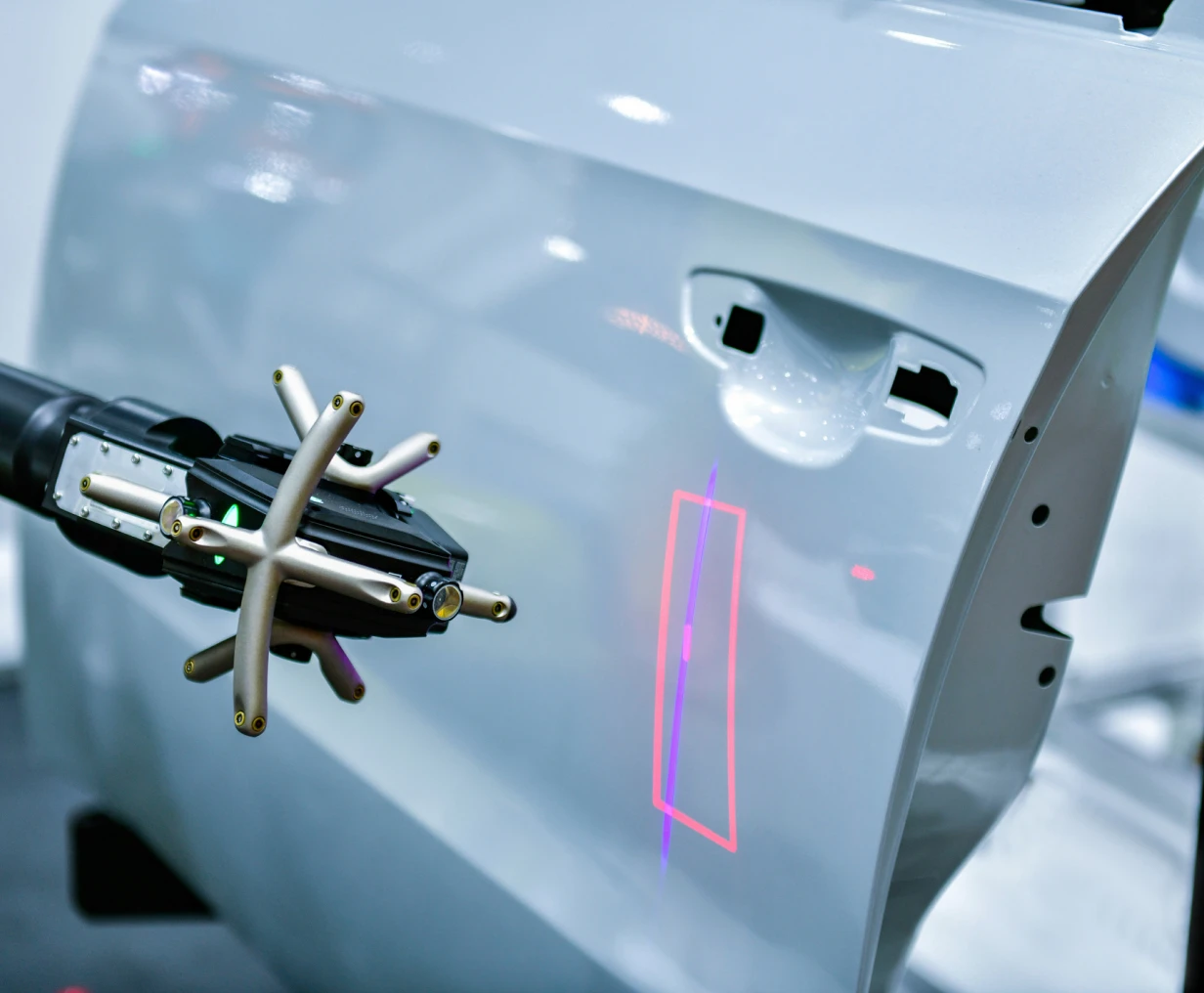 Robotic arm inspecting car door surface
